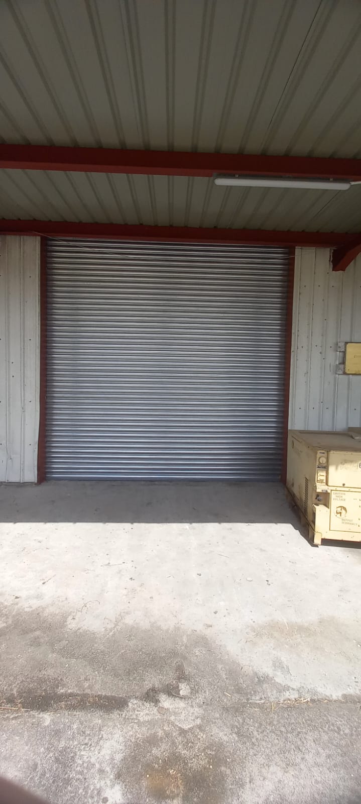 Wide view of the shutter door installation at CDC Timehri